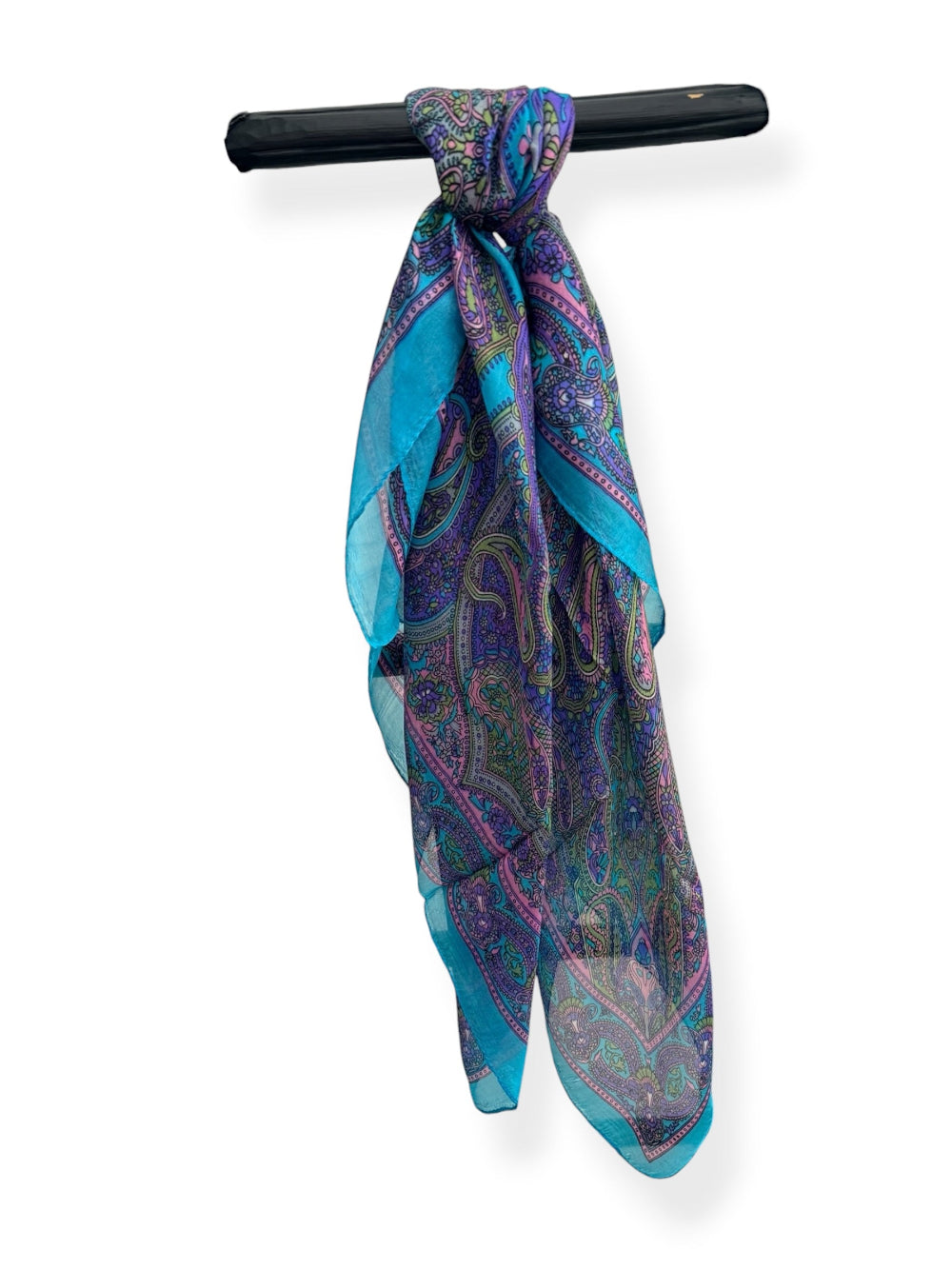 Pure silk square scarf in turquoise blue, lavender and violet with intricate multicoloured paisley design, soft pink detailing and bright turquoise border.