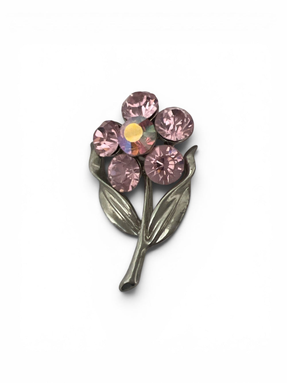 Pink crystal flower brooch with silver tone stem and leaf design